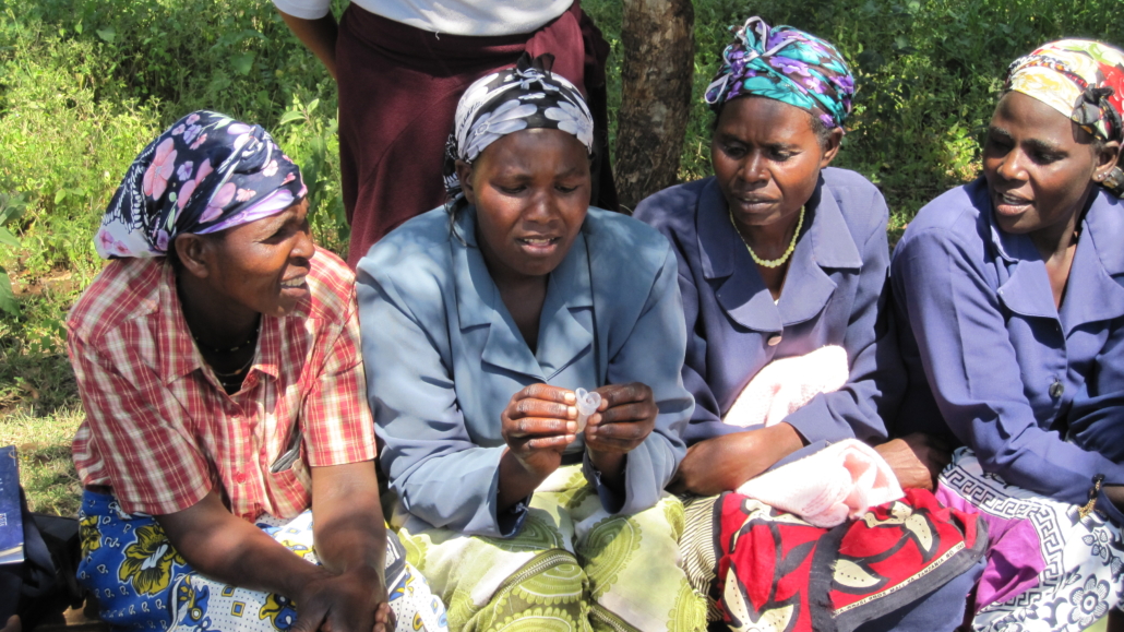 Women in Meru, Kenya, examining Menstrual Cups