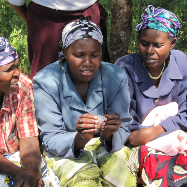 Women in Meru, Kenya, examining Menstrual Cups