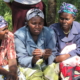 Women in Meru, Kenya, examining Menstrual Cups